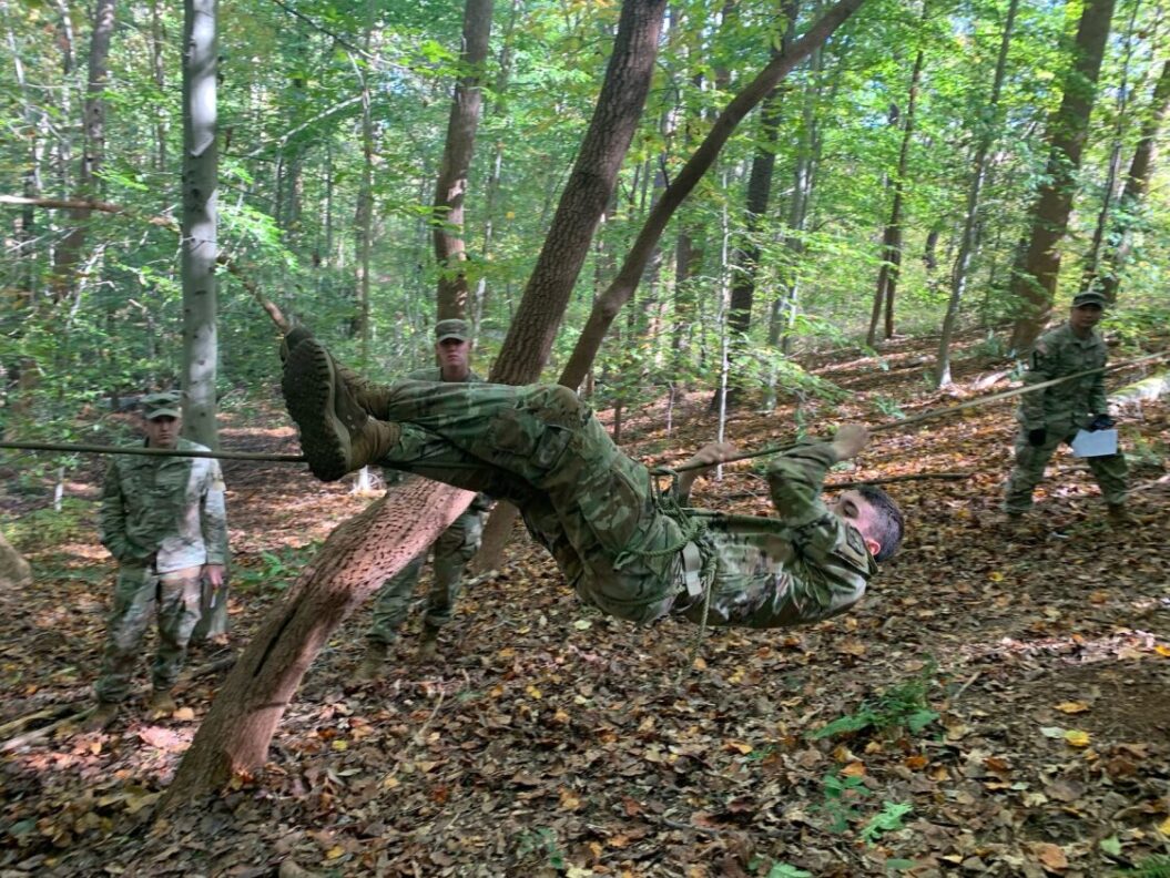 Cadet Atkinson navigating a rope bridge during the Ranger Challenge competition